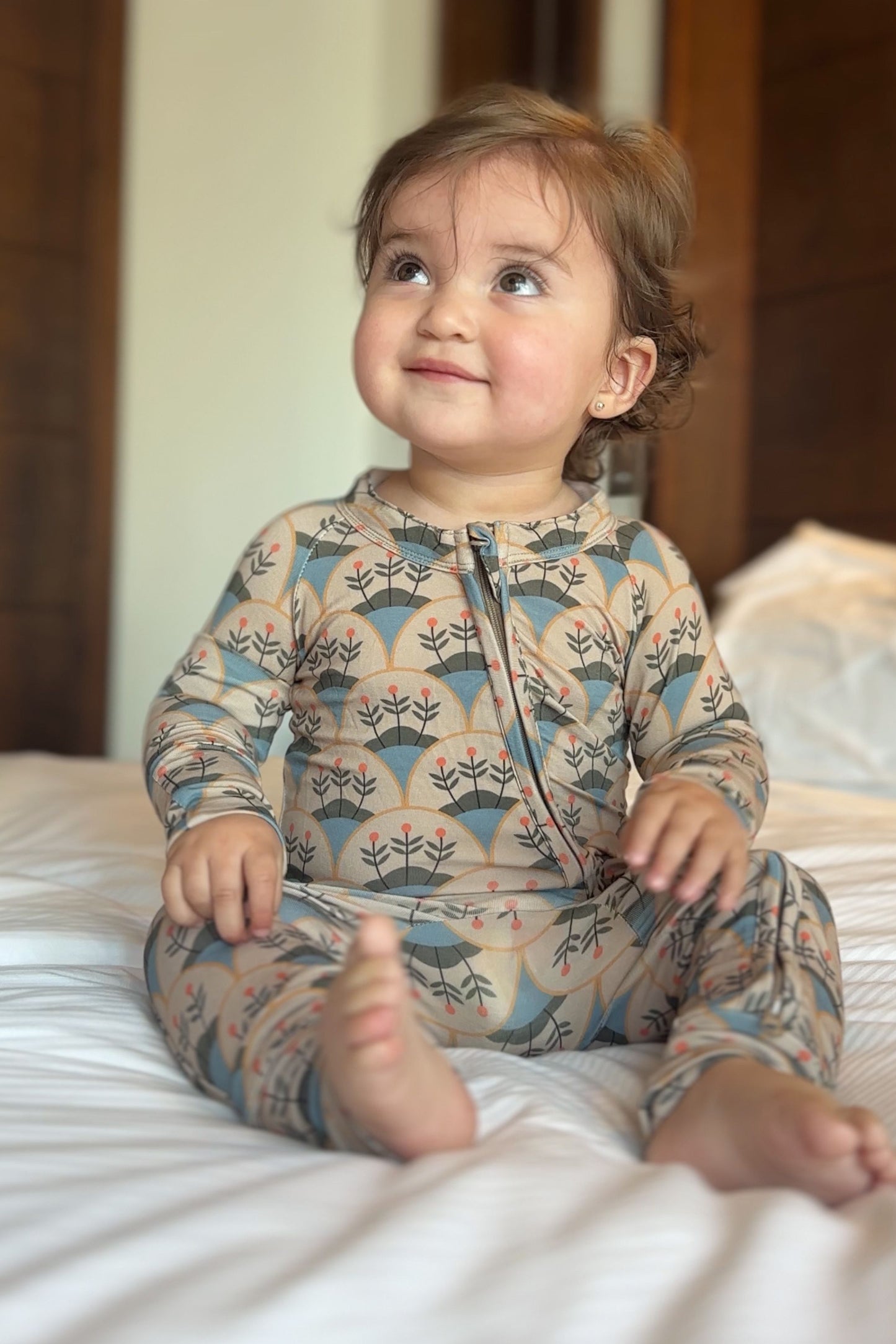 Bamboo baby pajamas in blue and beige with a boho floral print, soft and hypoallergenic, ideal for the delicate skin of the baby